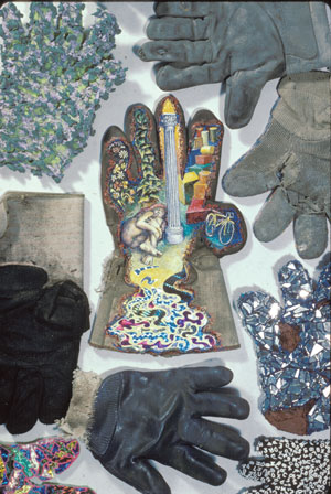 “Work Glove Dreaming” by Fred Gutzeit, 1983, (beeswax, pigment egg/oil glaze) is surrounded by discarded and reconstructed work gloves.